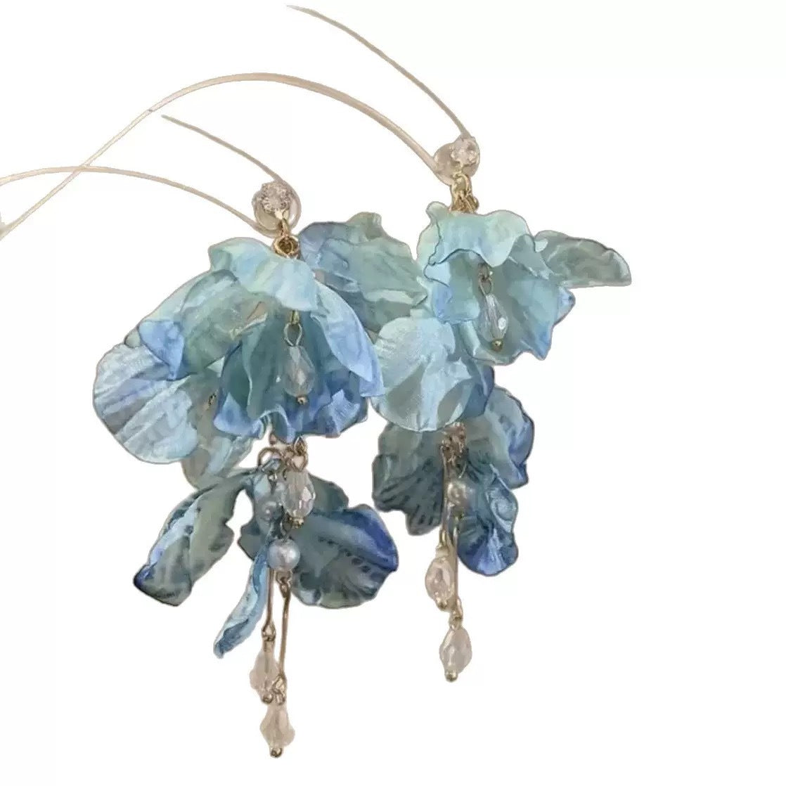 A girl with super fairy-like colorful flower earrings
