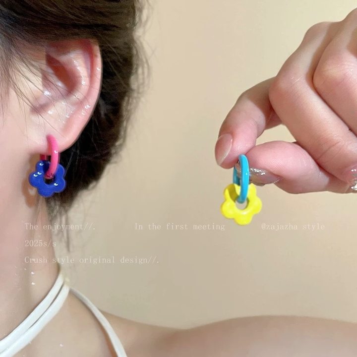 A girl with super fairy-like colorful flower earrings