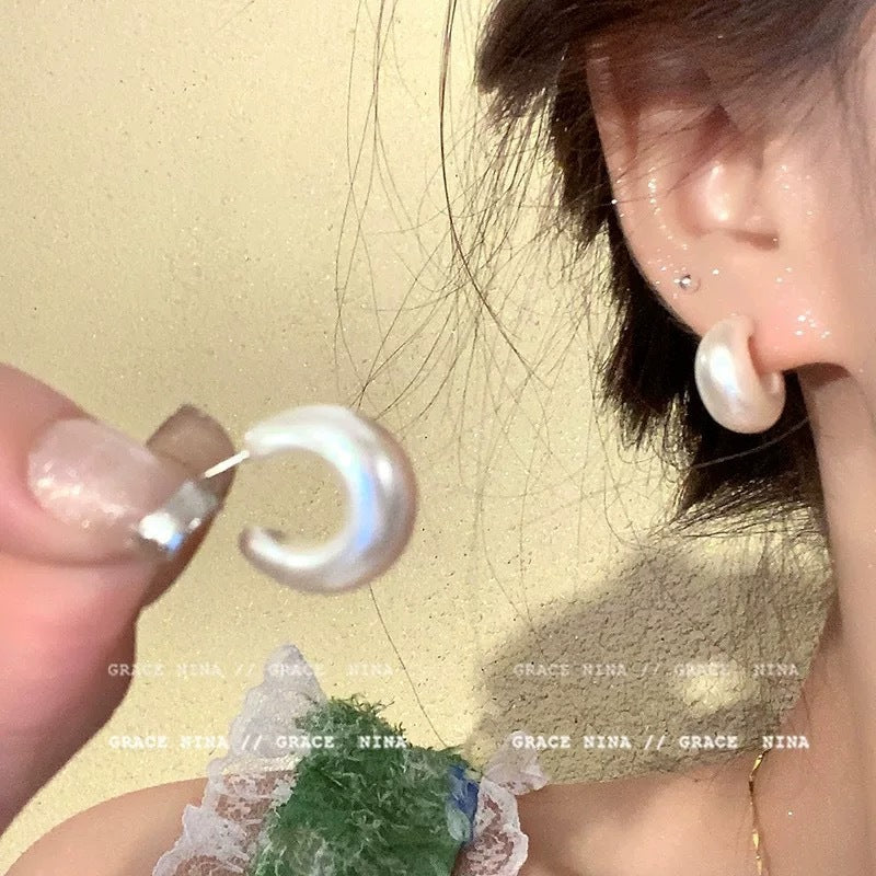 A girl with super fairy-like colorful flower earrings