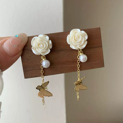 A girl with super fairy-like colorful flower earrings