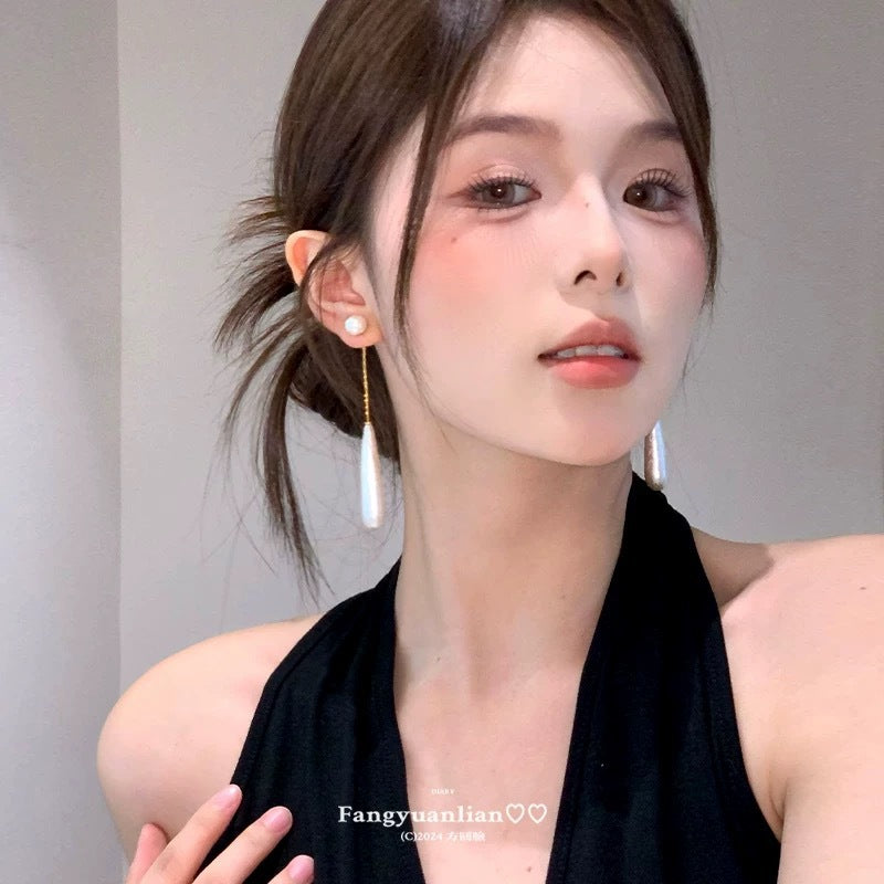 A girl with super fairy-like colorful flower earrings