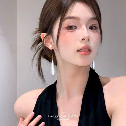 A girl with super fairy-like colorful flower earrings