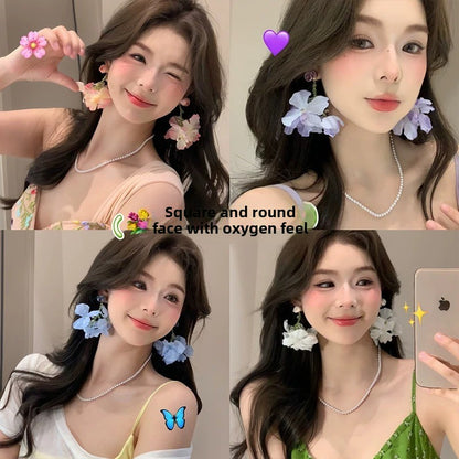 A girl with super fairy-like colorful flower earrings