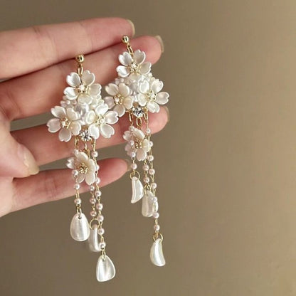 A girl with super fairy-like colorful flower earrings