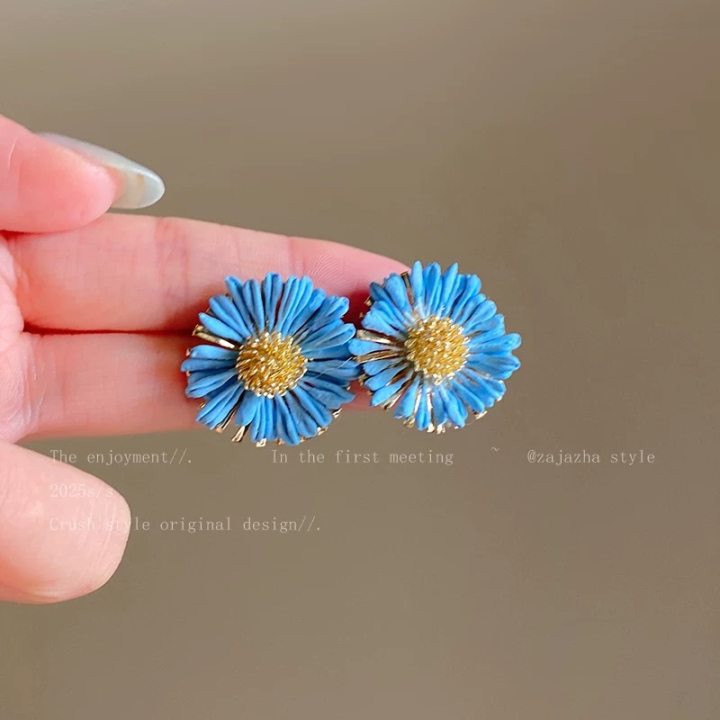 A girl with super fairy-like colorful flower earrings