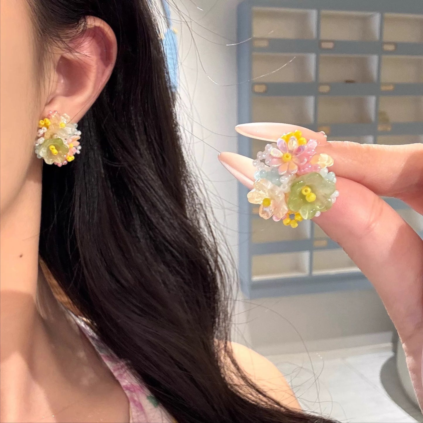 A girl with super fairy-like colorful flower earrings