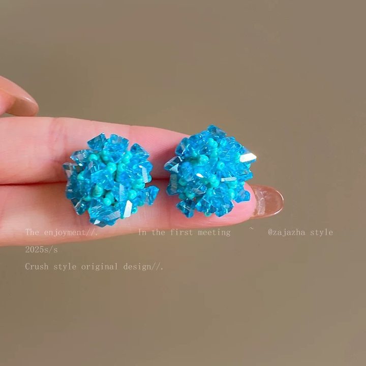 A girl with super fairy-like colorful flower earrings