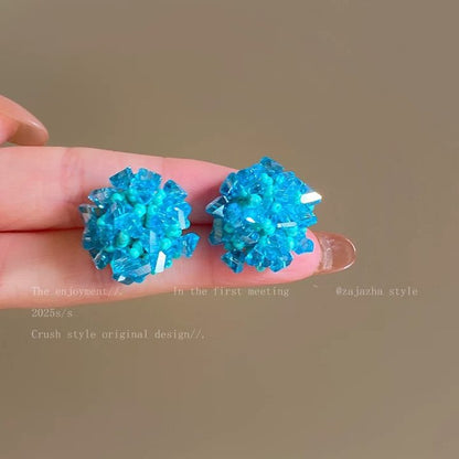 A girl with super fairy-like colorful flower earrings
