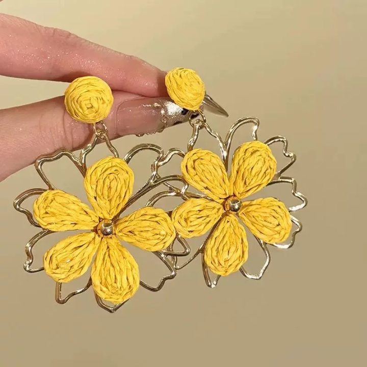 A girl with super fairy-like colorful flower earrings