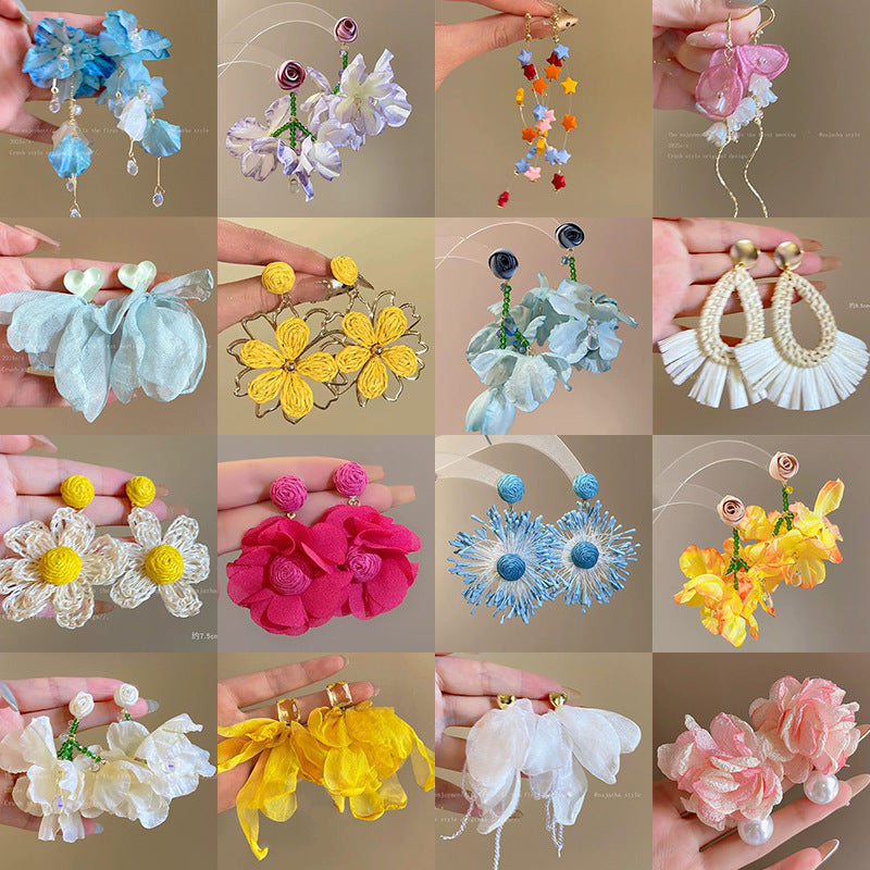 A girl with super fairy-like colorful flower earrings