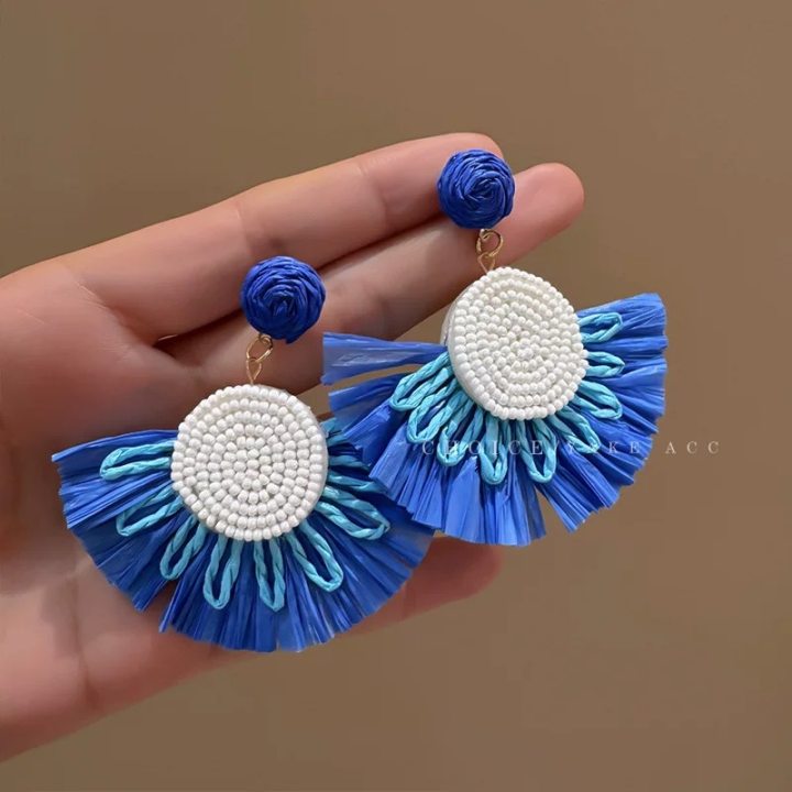 A girl with super fairy-like colorful flower earrings