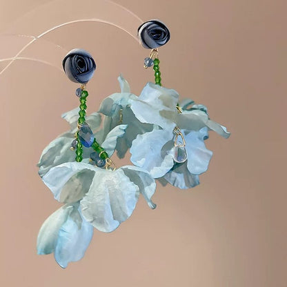 A girl with super fairy-like colorful flower earrings