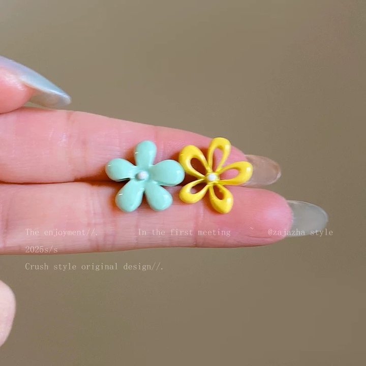 A girl with super fairy-like colorful flower earrings