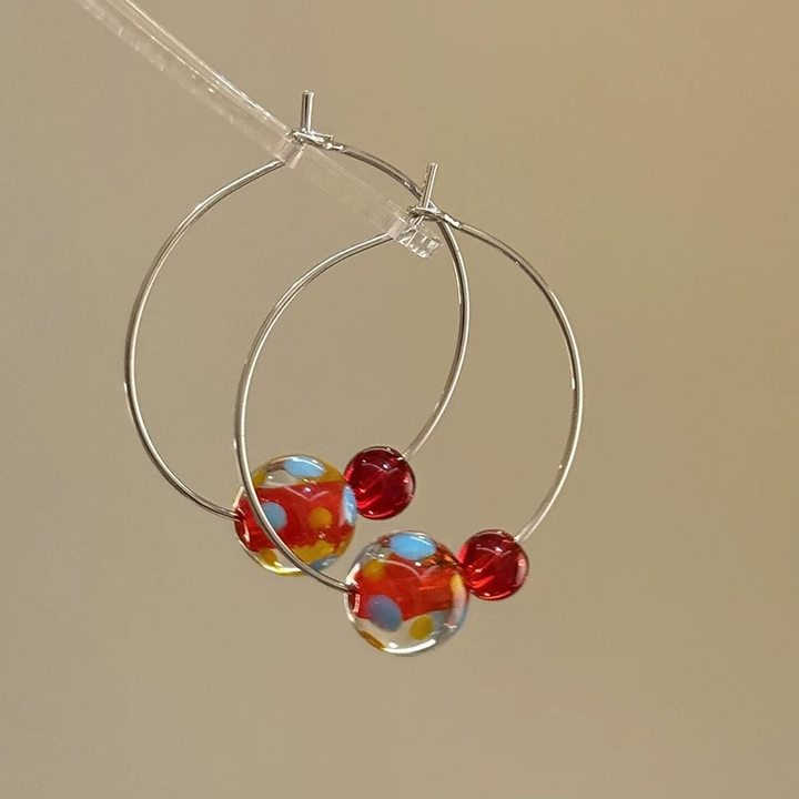 A girl with super fairy-like colorful flower earrings