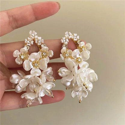 A girl with super fairy-like colorful flower earrings