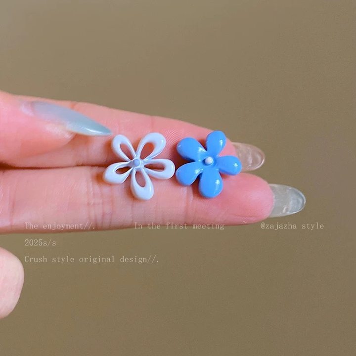 A girl with super fairy-like colorful flower earrings