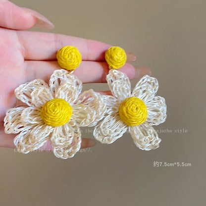A girl with super fairy-like colorful flower earrings