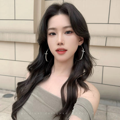 A girl with super fairy-like colorful flower earrings