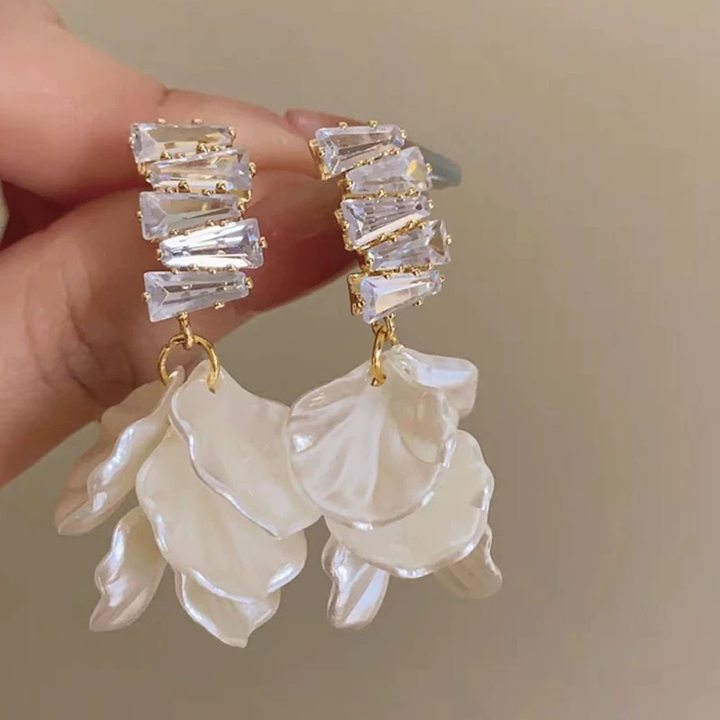 A girl with super fairy-like colorful flower earrings
