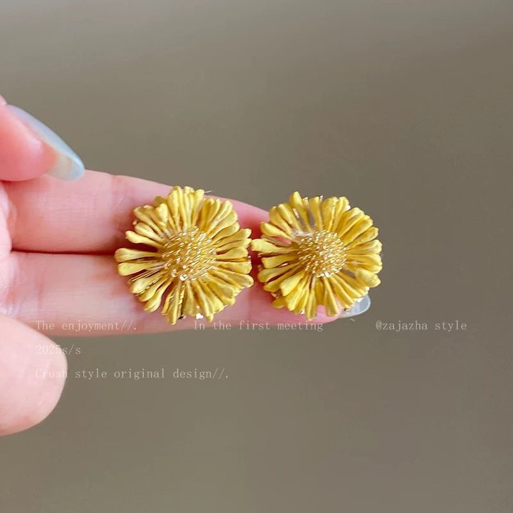 A girl with super fairy-like colorful flower earrings